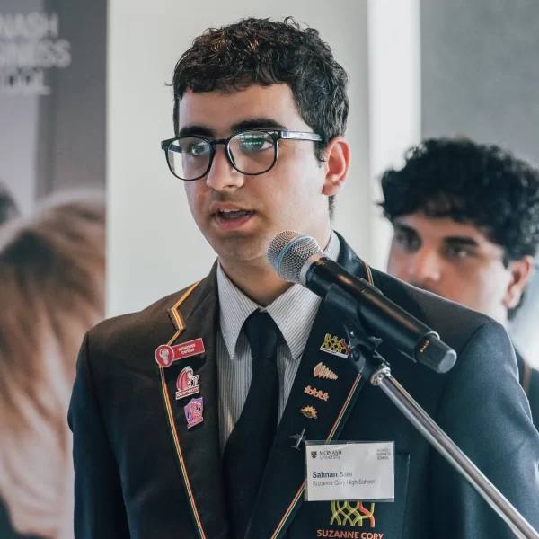 student speaking at microphone