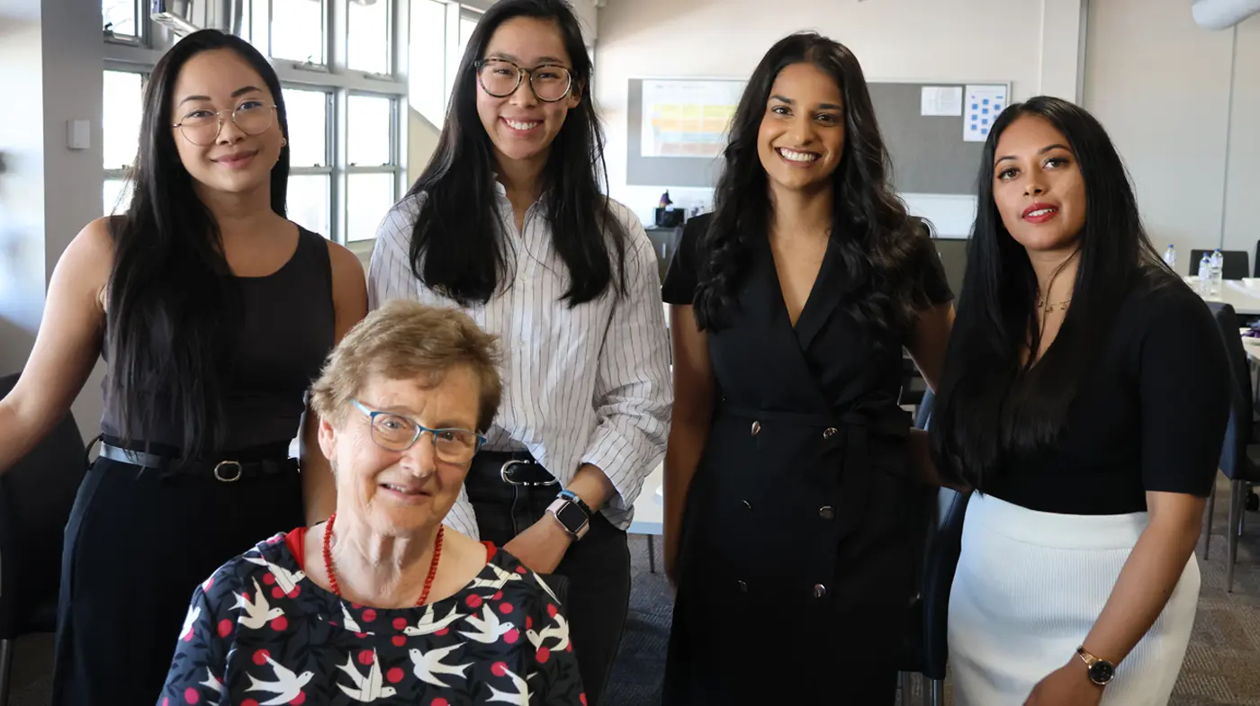 Professor Cory with four of our female alumni