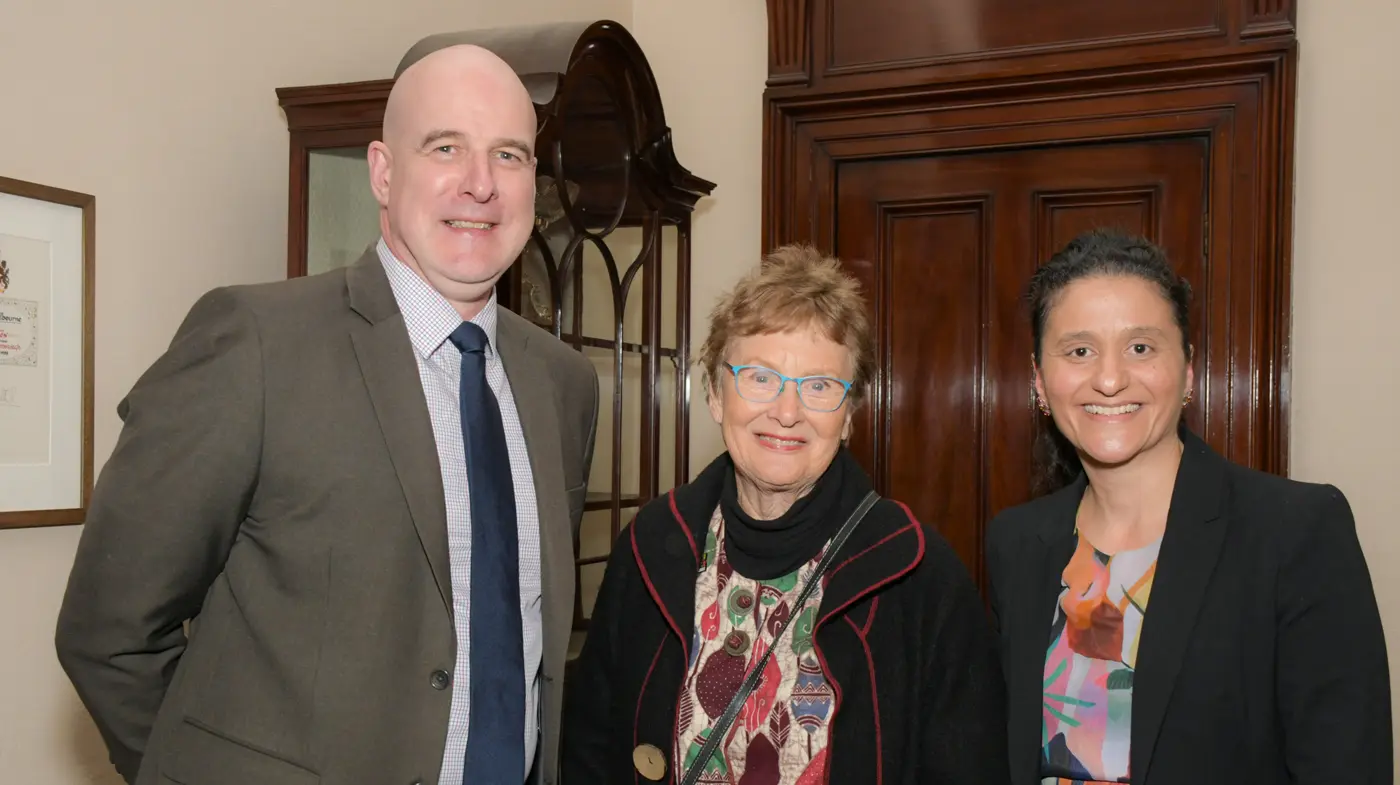 Professor Cory with a guest and staff member