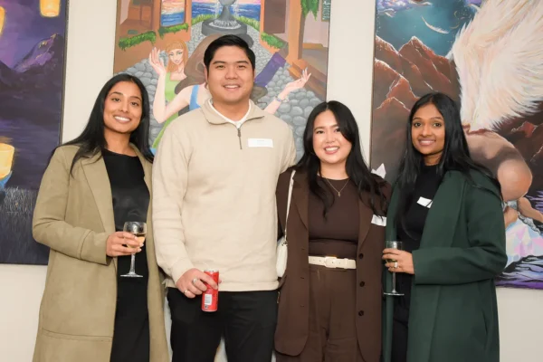 A group of alumni posing for a picture