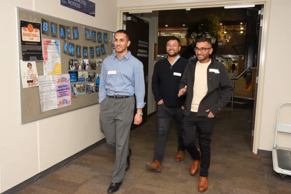 3 Alumni touring the school