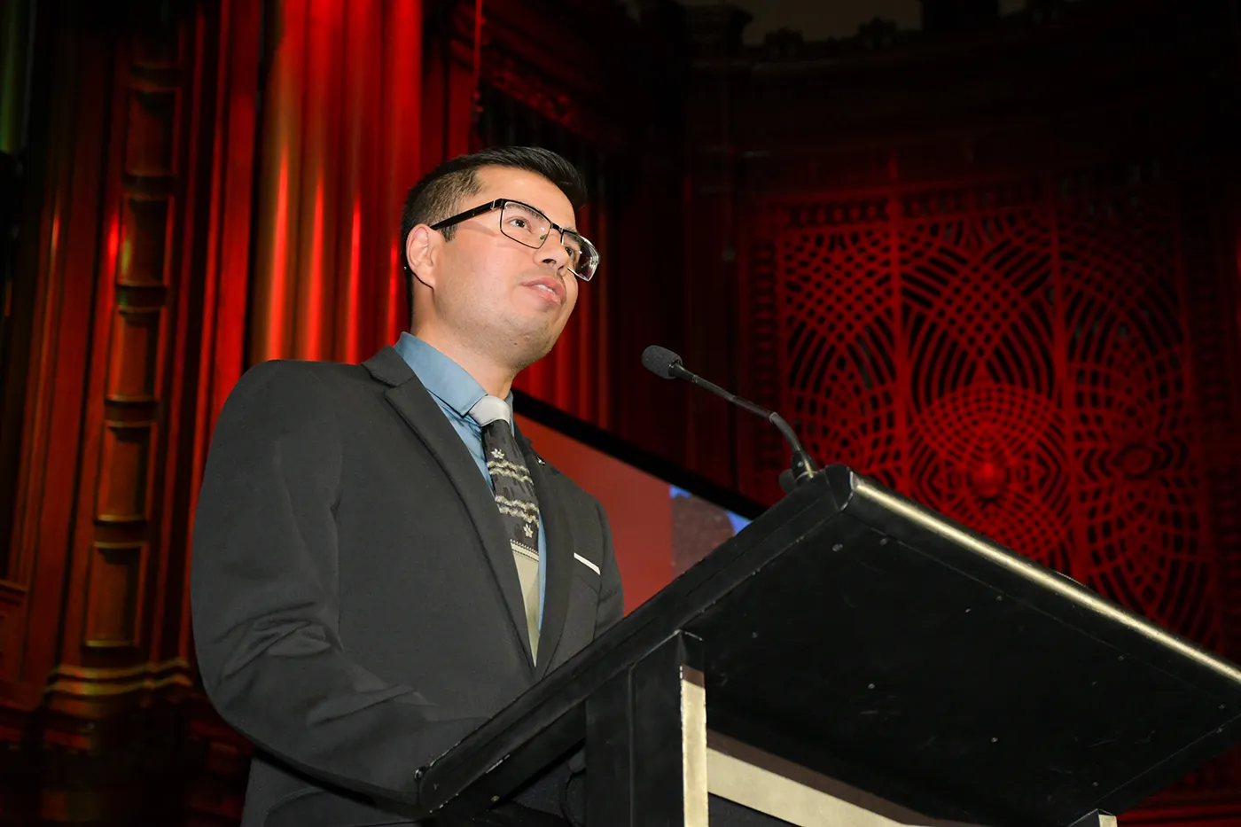 Man speaking at a podium