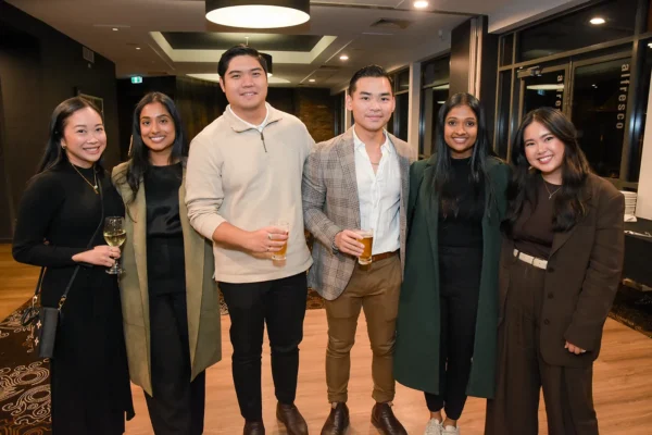 A group of alumni posing for a picture