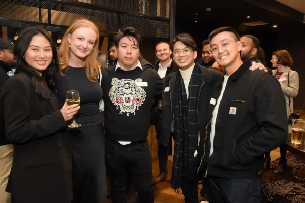 A group of alumni posing for a picture