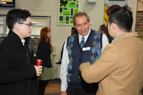 Alumni students talking their teacher