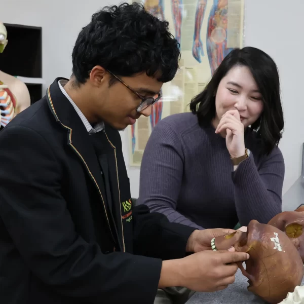 Student and a teacher with a skull